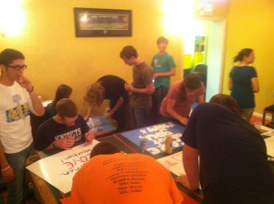 Newman students making signs for the Rally!